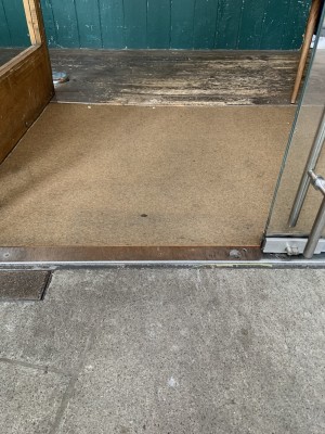 This shows the small metal bump on the threshold of the door.