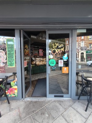 Grey framed glass doors. Push grey handles in centre to open.