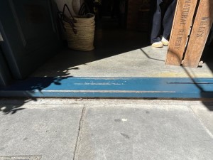 Small step from street level to doorway.