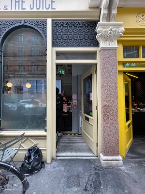 Facing entrance. Yellow framed door ahead.