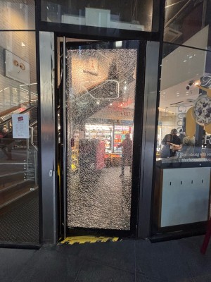 Glass door ahead. Push metal handle at left to open.