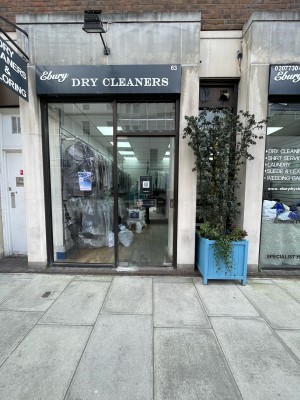 Metal-framed glass door ahead. Push from silver handle on right to open.