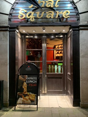 From street looking straight at main entrance. Double doors. Pull from centre to open. Sign on left obstructing left door.