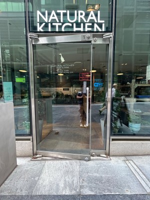 Single glass door. Pull vertical silver handle on right to open.