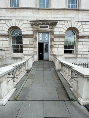From plaza facing venue. Path to entrance ahead.