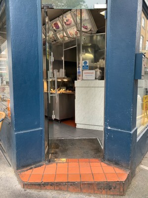 Glass wooden door ahead. Push from handle on right to open.