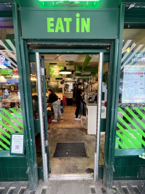 Green framed glass door. Push from right side to open.
