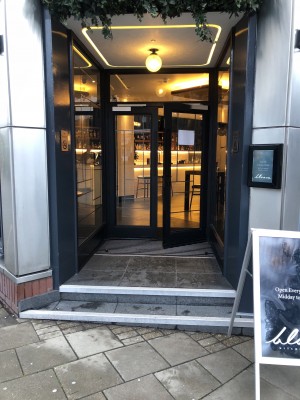 Photo of main entrance. Pull handles in middle to open.
