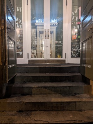 Large steps leading up to a 2 sets of double doors.