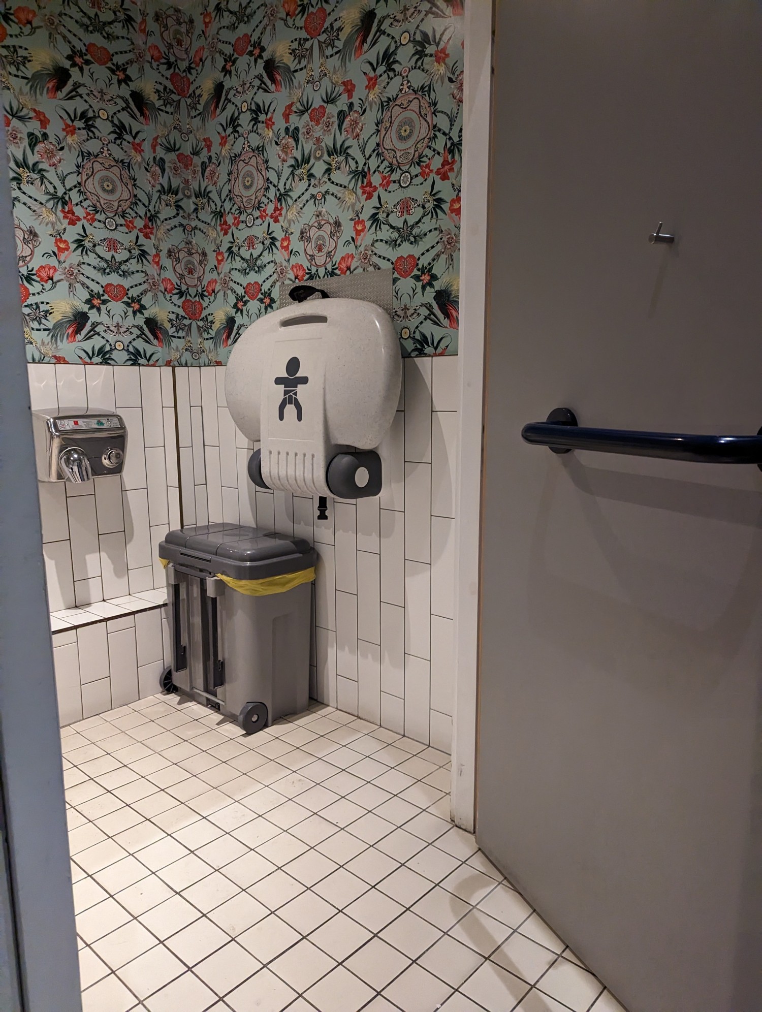 Baby change and wide outward opening door