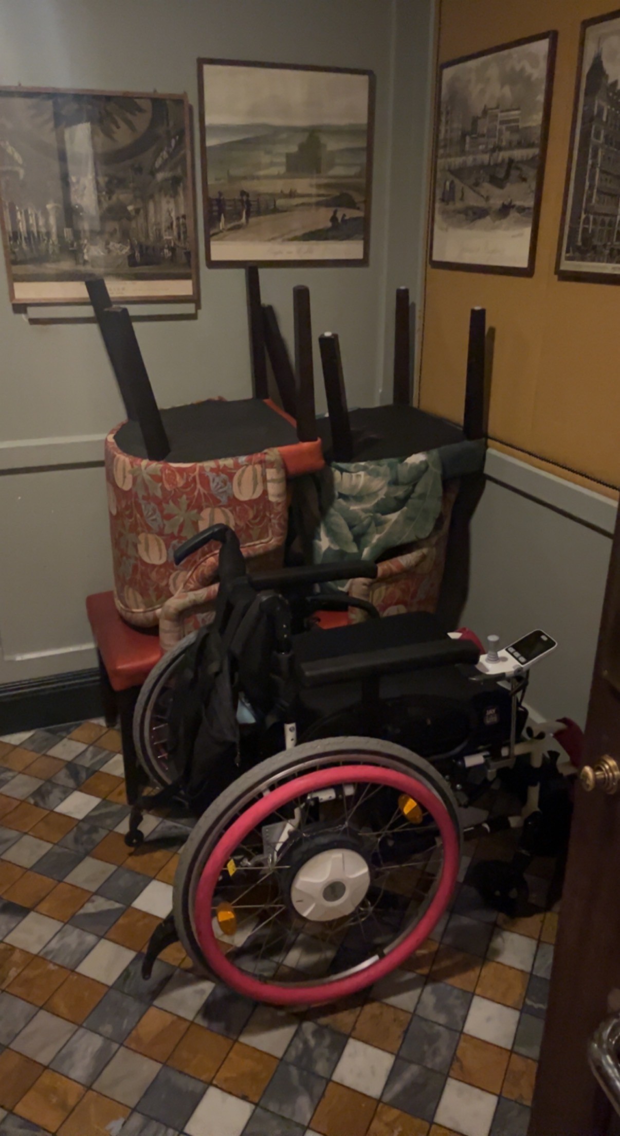 Chairs stored in back left. Accessible bathroom through additional door also used as a room to store extra chairs & prams. Emergency wheelchair stair chair stored here too.