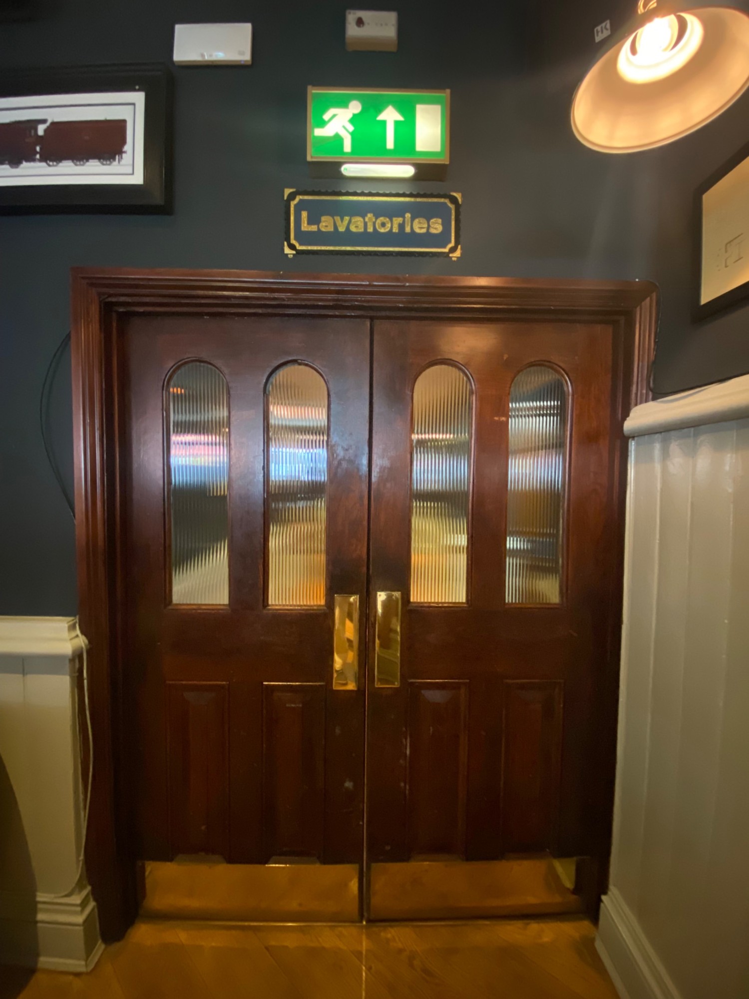 From right-end of main area, facing straight. Double wooden door in front. Push from centre to open.