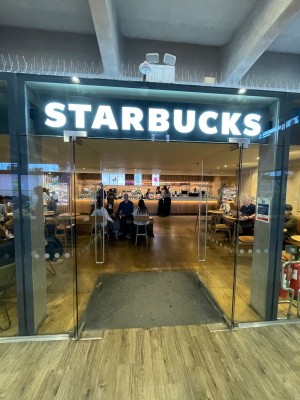 Glass double doors with handle in centre, push to open.