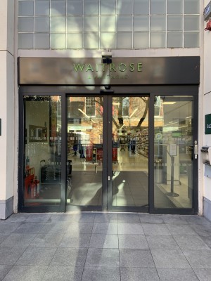 This sushi daily counter is accessible via the main entrance to the Waitrose. The doors are automatic with a slight bump on the threshold. There is a security sensor right the the middle of the doorway as it opens.