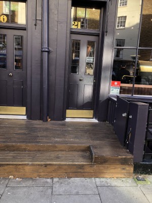Photo of main entrance. Push on right to open.