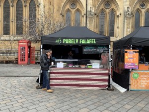 This venue is a stand on a cordoned off street area. There is a counter which you can order at, which is covered by a tent to protect the workers from the elements. The worker will take your order and there is no need to self select items.