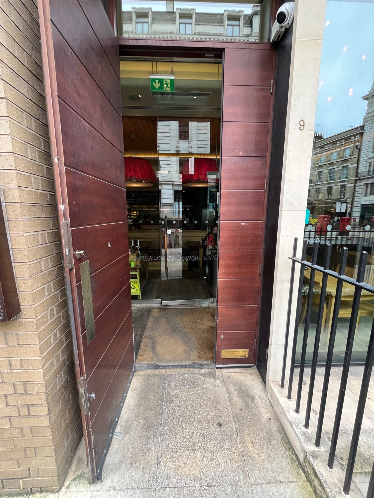 From end of path facing straight. Brown door. Pull open from right side.