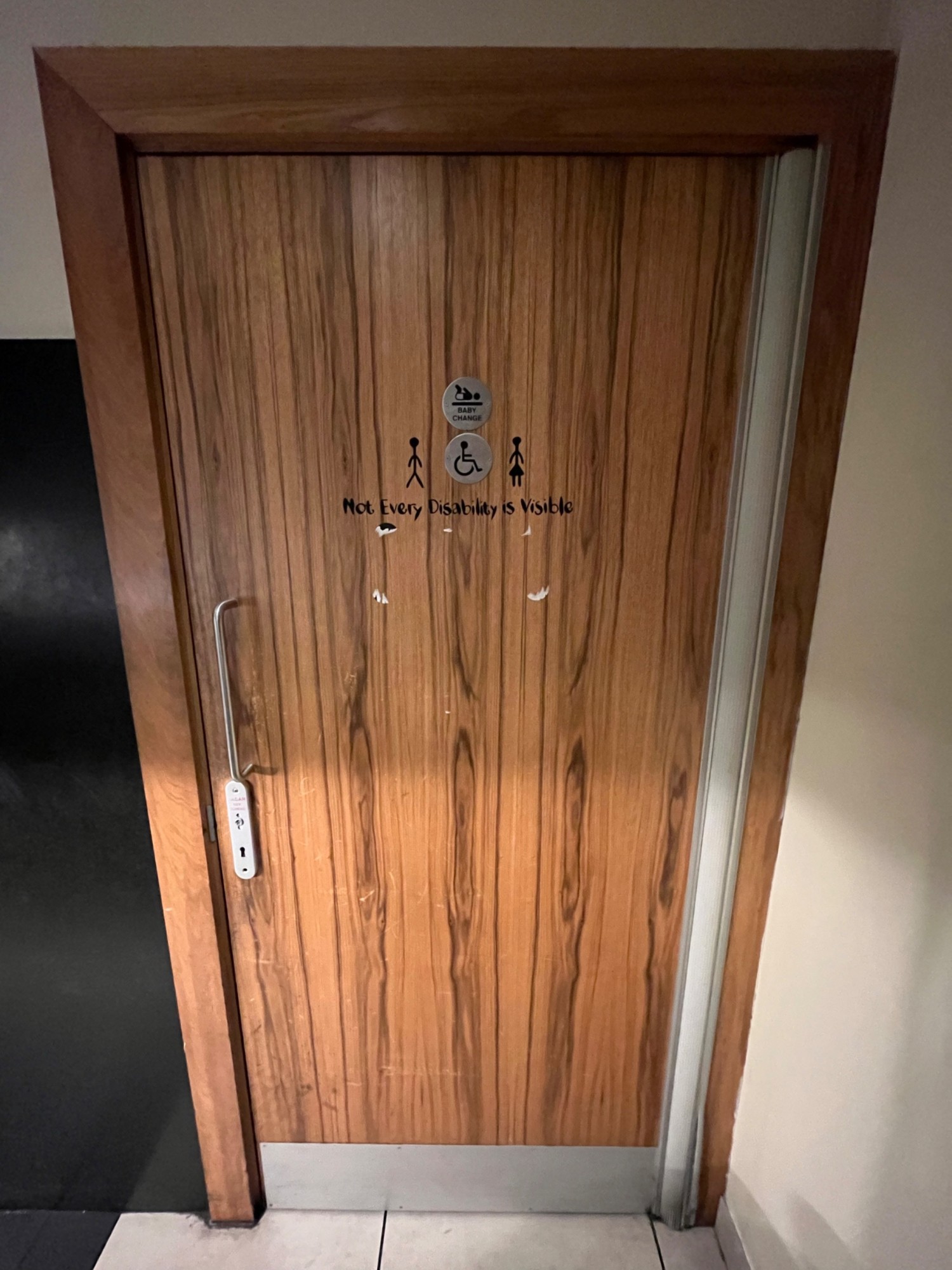 From end of path facing left. Brown door. Pull open via handle on left. Unlock under handle using radar key.