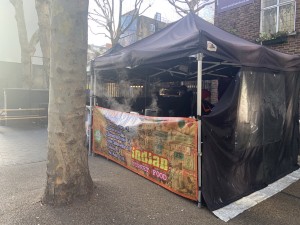 This photo shows the outdoor stand for this venue. There is a wide opening at the front of the tent which you can order from. Note there is a tree directly before the tent. There is no counter to place items down for customers.