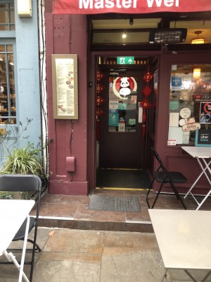Photo of main entrance. Ish door on right to open. There are 2 small bumps, one at the door and one about a metre before it.