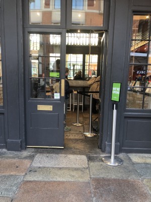 Photo of main entrance. Push in middle to open. Counter is to the right indoors.
