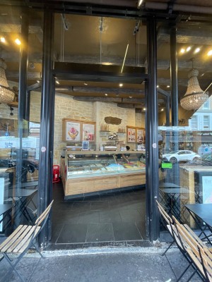 Black framed glass doors ahead. Push open from centre.