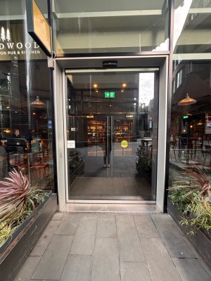 First glass door. Slides open to right.