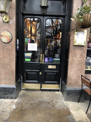 Photo of main entrance. Push in middle to open. Bar is directly ahead on the inside.
