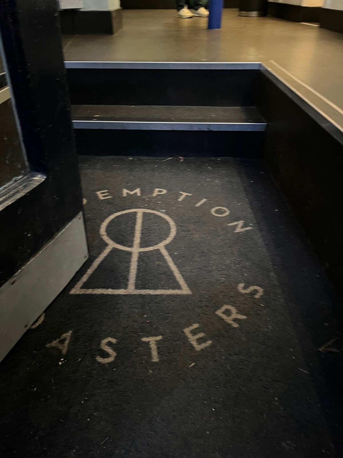 Doormat after door followed by two steps up to floor.