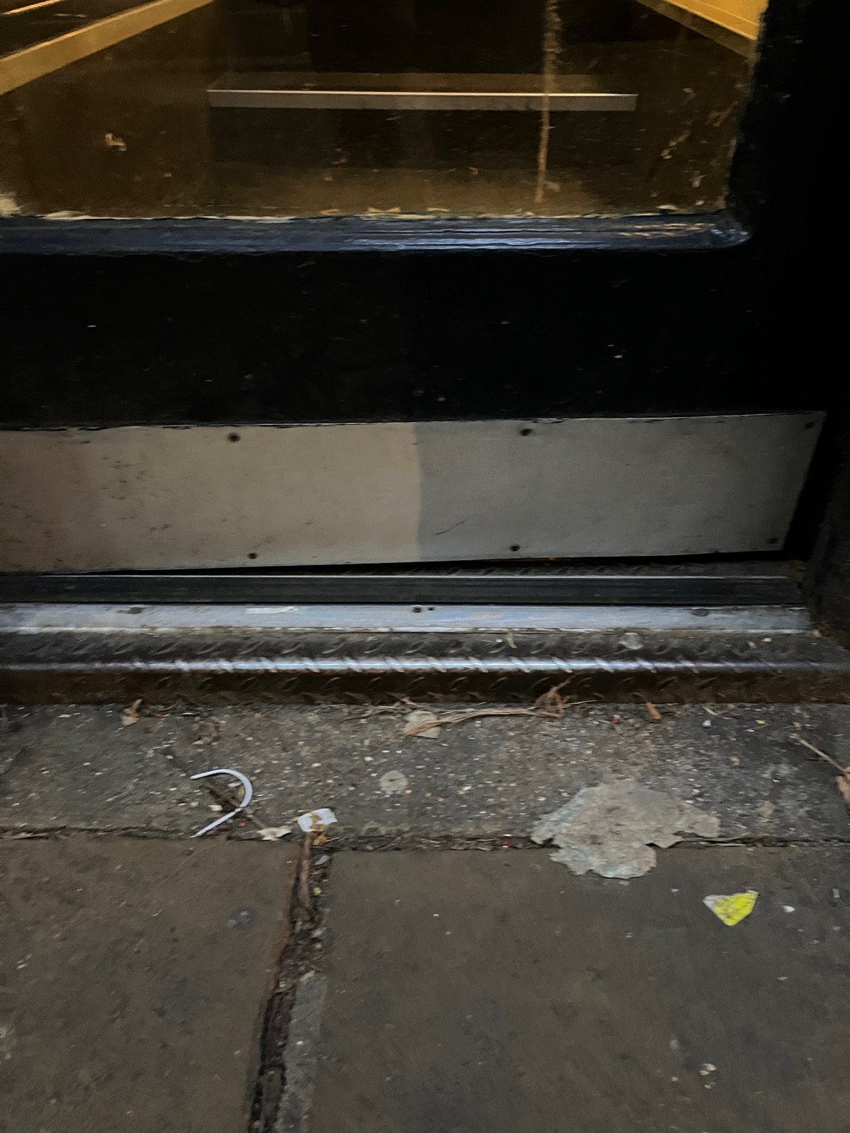 Small step at foot of door.