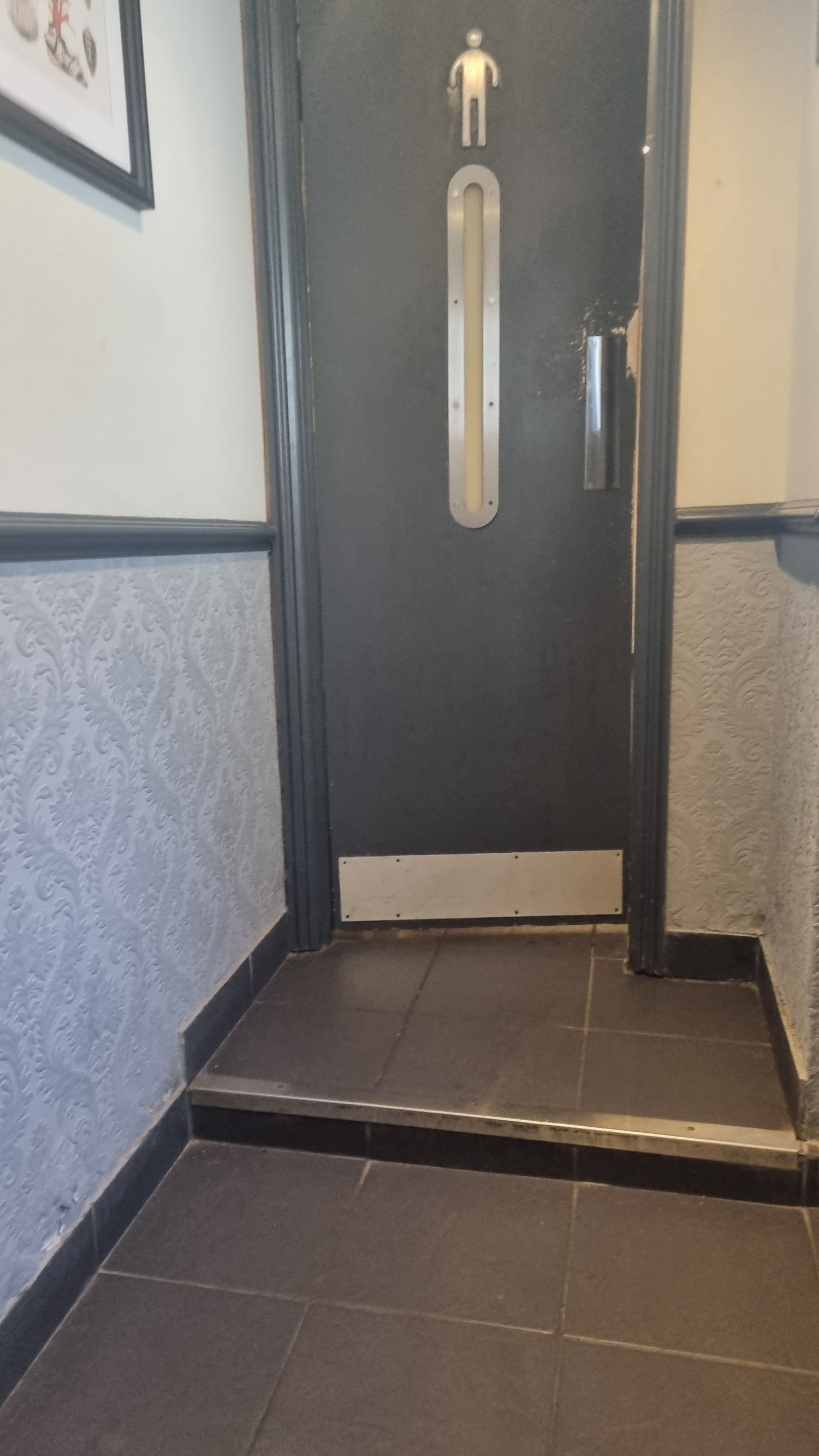 Step to men's bathroom