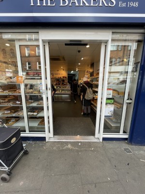 Glass doors with white frame. Slide from right to left, to open.