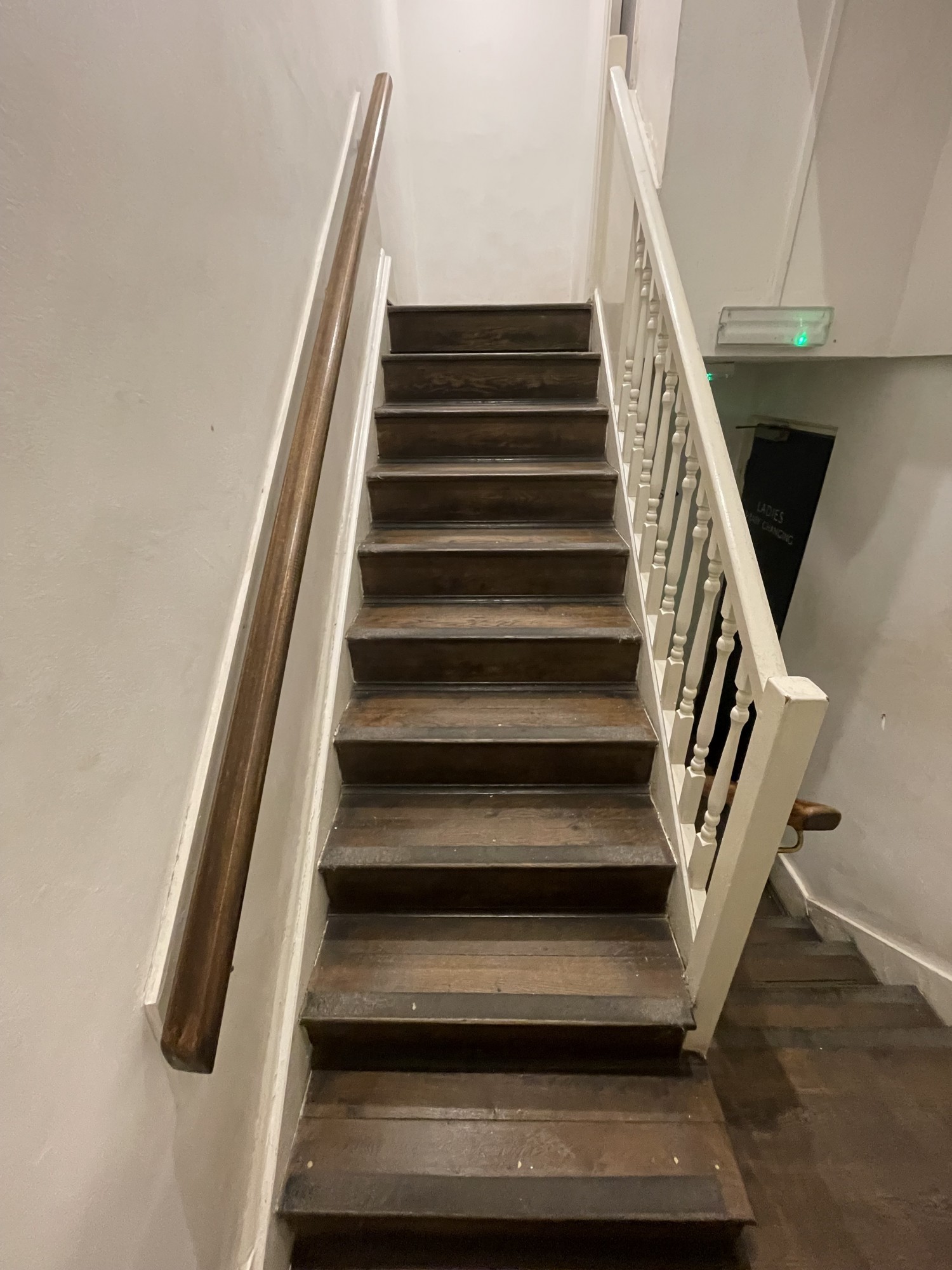 10 steps leading to gents bathroom. Door to gents is to the right at the top of staircase. There is a handrail on both sides.