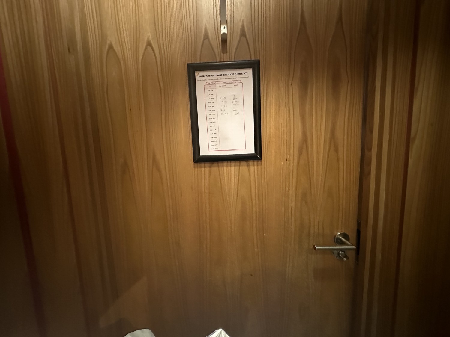 View from the bathroom door from the inside. There is a hanging hook located on the top part of the door.