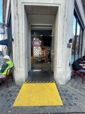 Double glass door. Pull metal handles from centre to open. Landing area before door. Doormat after door.