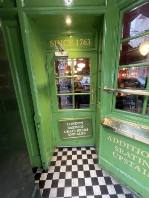 Door is a pull door that should be pulled from the right side. There is a handle on the right side of door at centre height of the door. There is a step before the door.