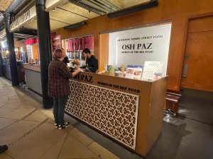 From inside market facing venue. Service counter ahead. No door.