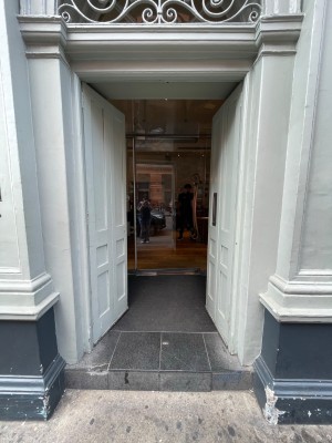 White doors, push from centre to open.