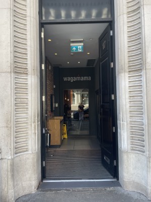 Double black wooden doors. Push from centre to open.
