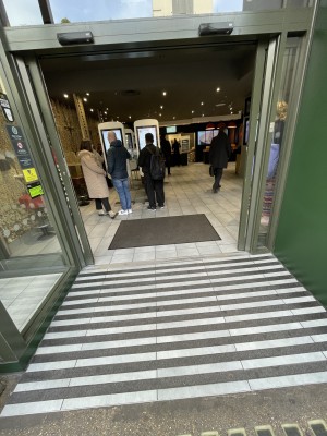 Taken from the street. There is a built in ramp leading to automatic double doors that open upon approach.