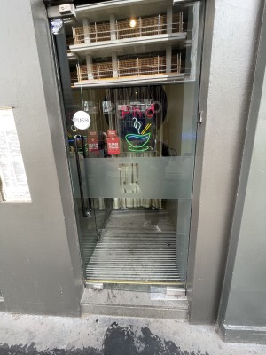 First door of entrance push door to be pushed from the left side via handle on the left at centre height of the door. Step before the door.