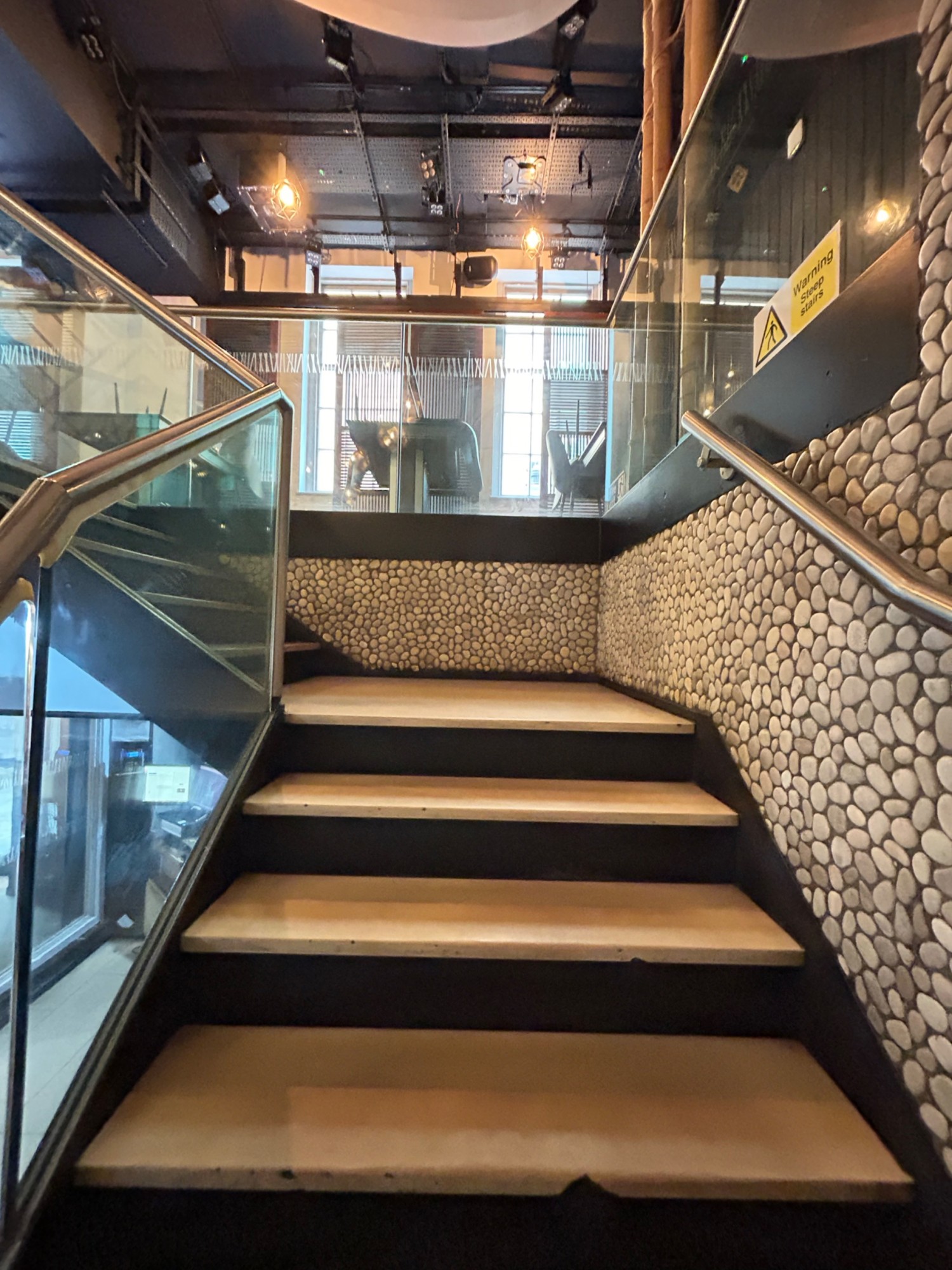 From curve, facing straight. Staircase ahead, then landing.