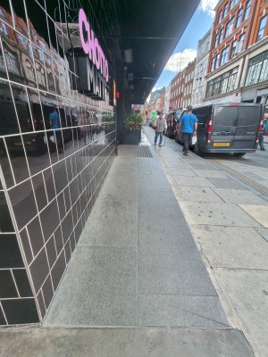 From corner of venue facing straight. Built-in ramp ahead to entrance on left.