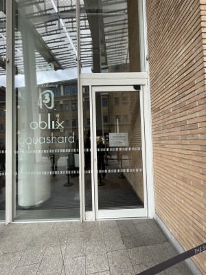 Entrance to the building. There is a single door which pushes open from the left.