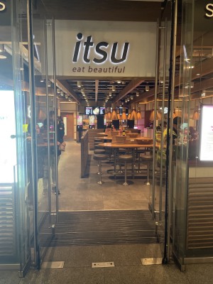 Glass doors with metal handles at centre. Pull to open.