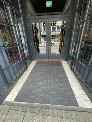 Built in ramp leading to double pull doors. Pull from the middle of doors to open