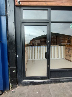 Entrance to left of venue. Push door via small handle on right side.
