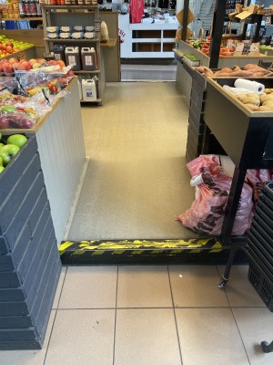 View of the entrance to the stand. There is a single step leading up to the retain area.