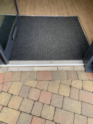 (2) Small metal bump on threshold of door.