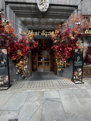 Photo of main entrance. Large open double doors leading to another set of double doors.